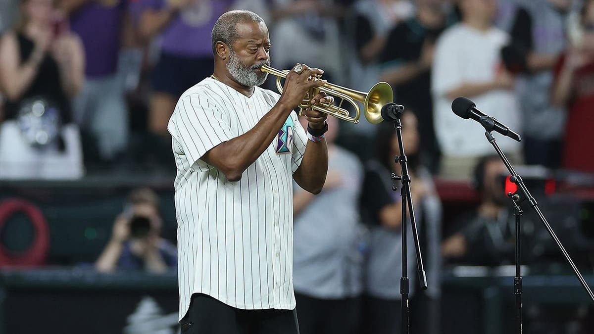 Dr. Jesse McGuire performs the national anthem at Chase Field.