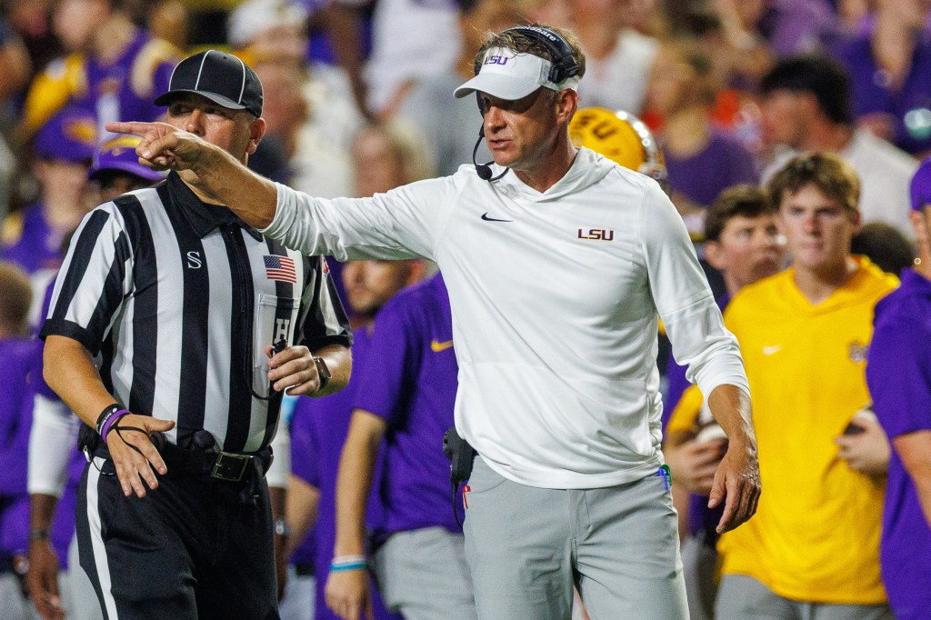 LSU Tigers head coach Lane Kiffin reacting to a play.