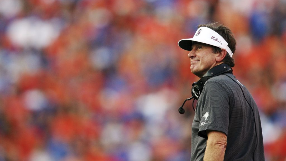 Steve Spurrier looks back over his shoulder during a football game.