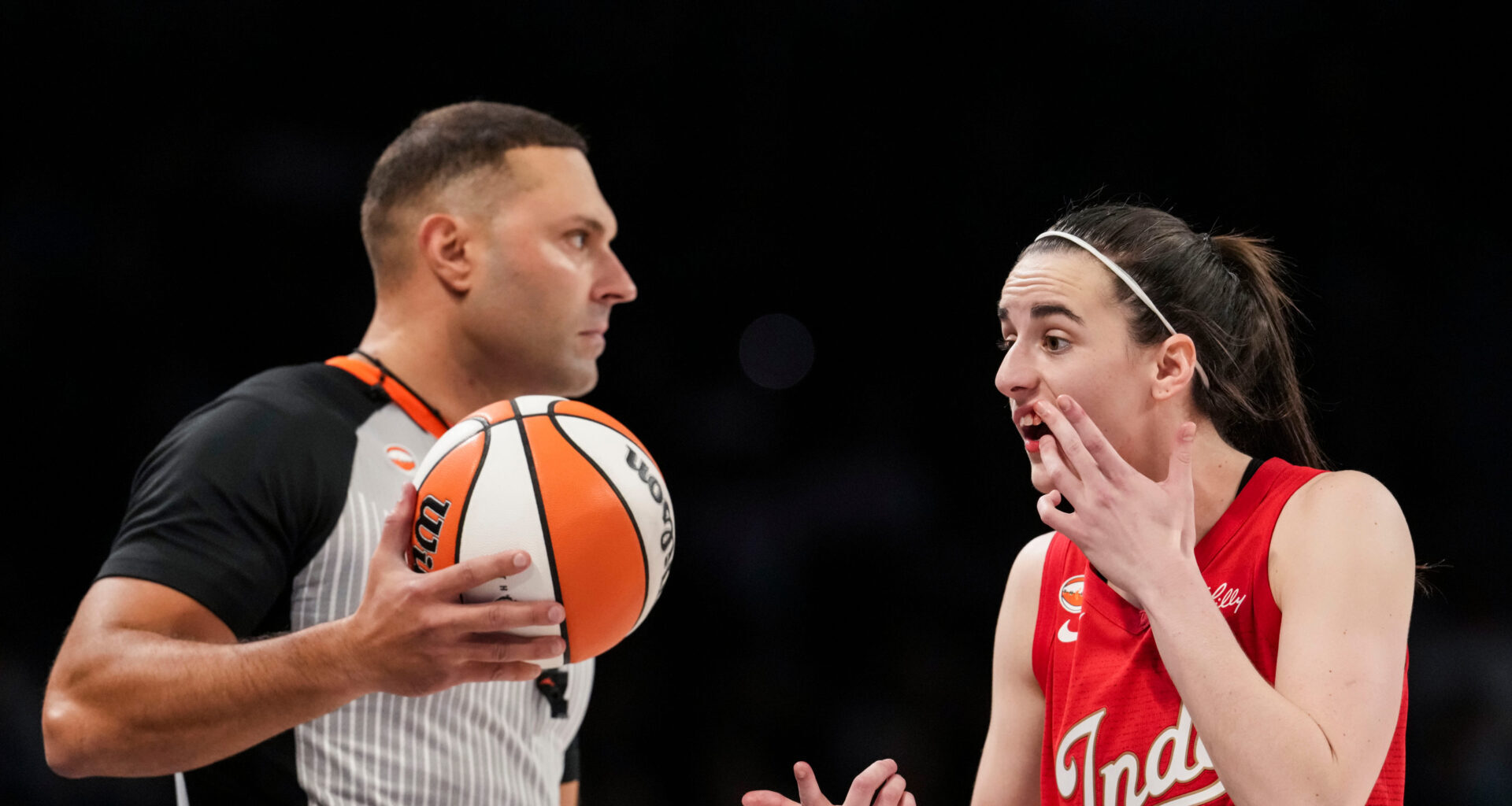 Indiana Fever guard Caitlin Clark (22) shows her mouth bleeding to an official Thursday, Oct. 1, 2026, during the second half of
