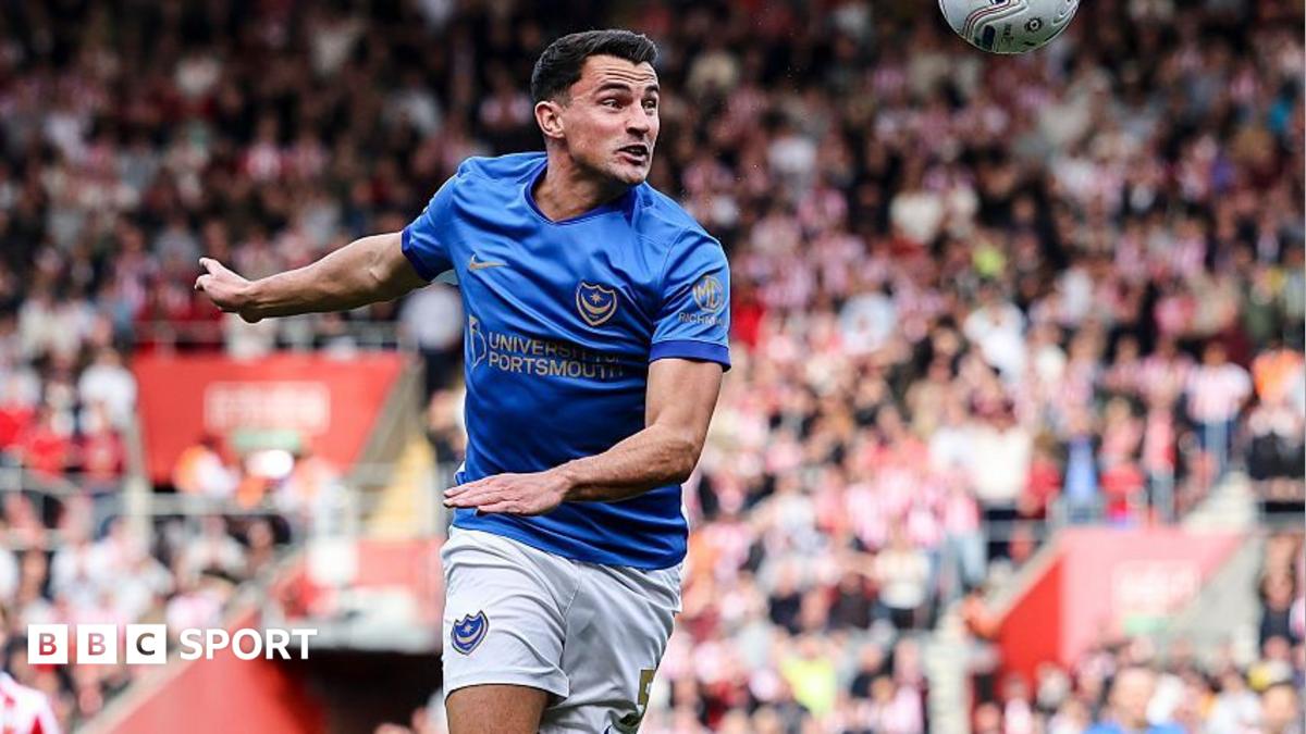 Regan Poole heads the football