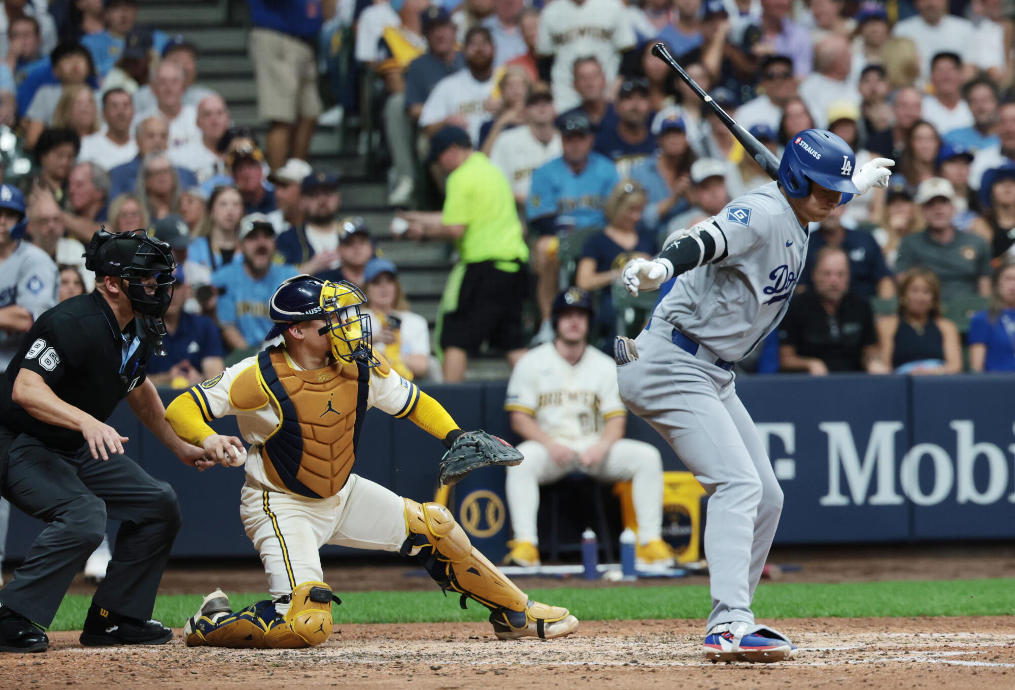 Dodgers designated hitter Shohei Ohtani strikes out during the sixth inning of Game 2 of the NLCS against the Brewers.