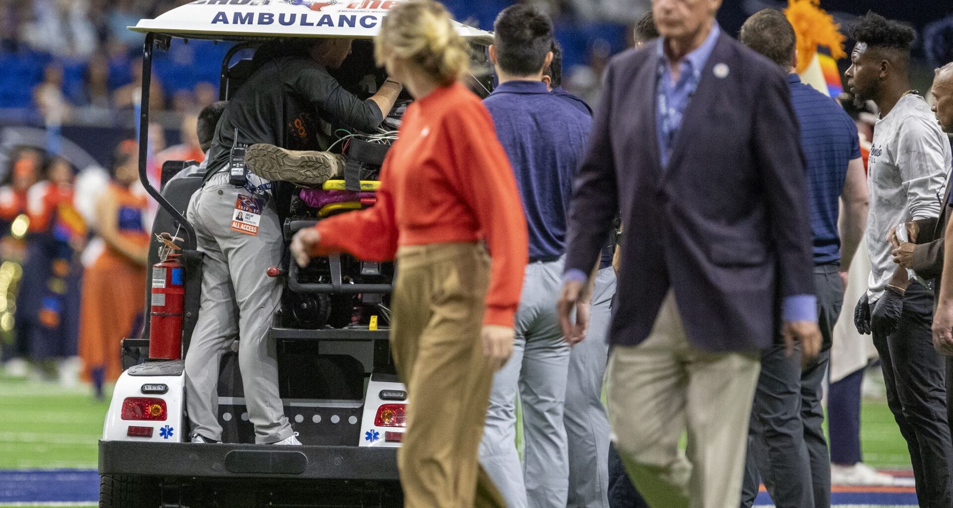 Emergency personnel tend to a military service member who fell from the rafters of the Alamodome while participating in a rappelling demonstration before the UTSA-Navy football game on Saturday, October 17, 2026.