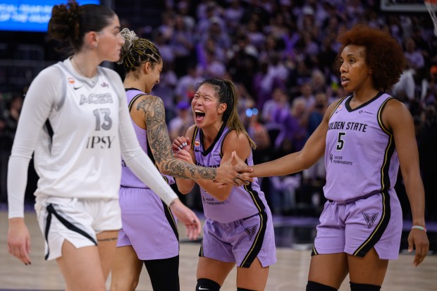 Golden State Valkyries' Kaitlyn Chen (2) celebrates with teammate Gabby Williams (1) after defeating the Las Vegas Aces during Game 1 of the WNBA Semifinals at Chase Center in San Francisco, Calif., on Sunday, Oct. 4, 2026. The Golden State Valkyries defeated the Las Vegas Aces 71-60. (Jose Carlos Fajardo/Bay Area News Group)