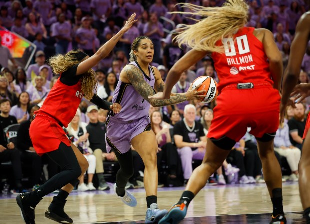 Golden State Valkyries' Gabby Williams (1) drives with the ball against Atlanta Dream's Jordin Canada (3) and Atlanta Dream's Naz Hillmon (00) in the third quarter during game 1 of the WNBA Finals at the Chase Center in San Francisco, Calif., on Saturday, Oct. 17, 2026. (Shae Hammond/Bay Area News Group)