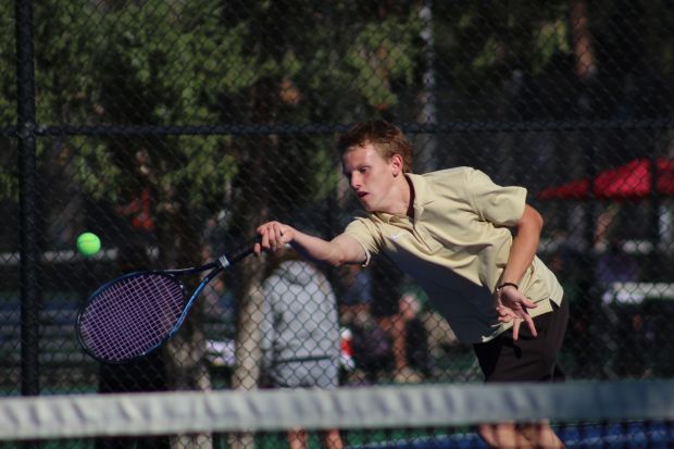 Cañon City High School senior Noah Donald hits a forehand during his 6-3, 6-0 win over Pueblo Centennial's Lucas Lucero in the Class 4A Region 7 boys tennis playback finals match Friday, Oct. 9, 2026, at Pueblo City Park in Pueblo. (Luke Lyons/Daily Record)