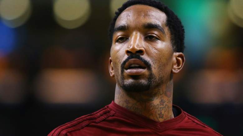 J.R. Smith watches from the bench.