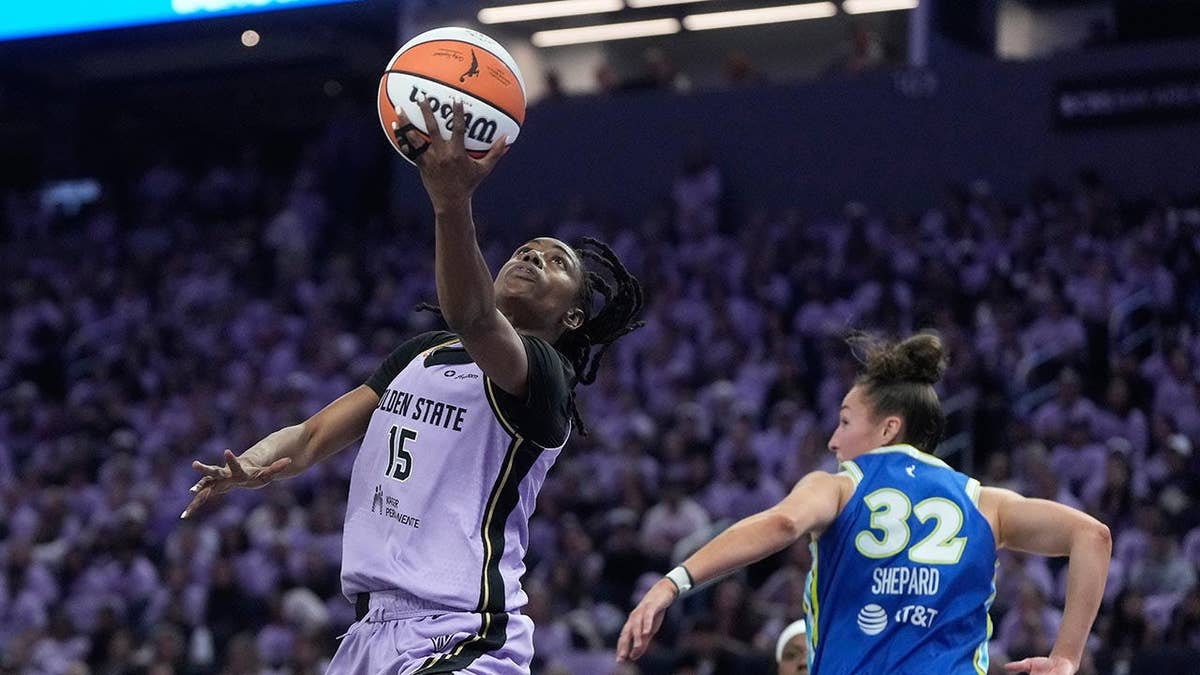 Tiffany Hayes attempting to shoot the ball during a WNBA playoff game