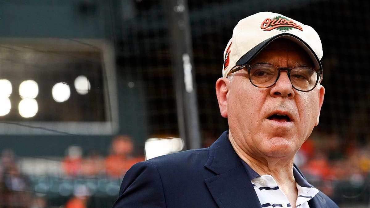 David Rubenstein stands on the field before the game at Oriole Park at Camden Yards.