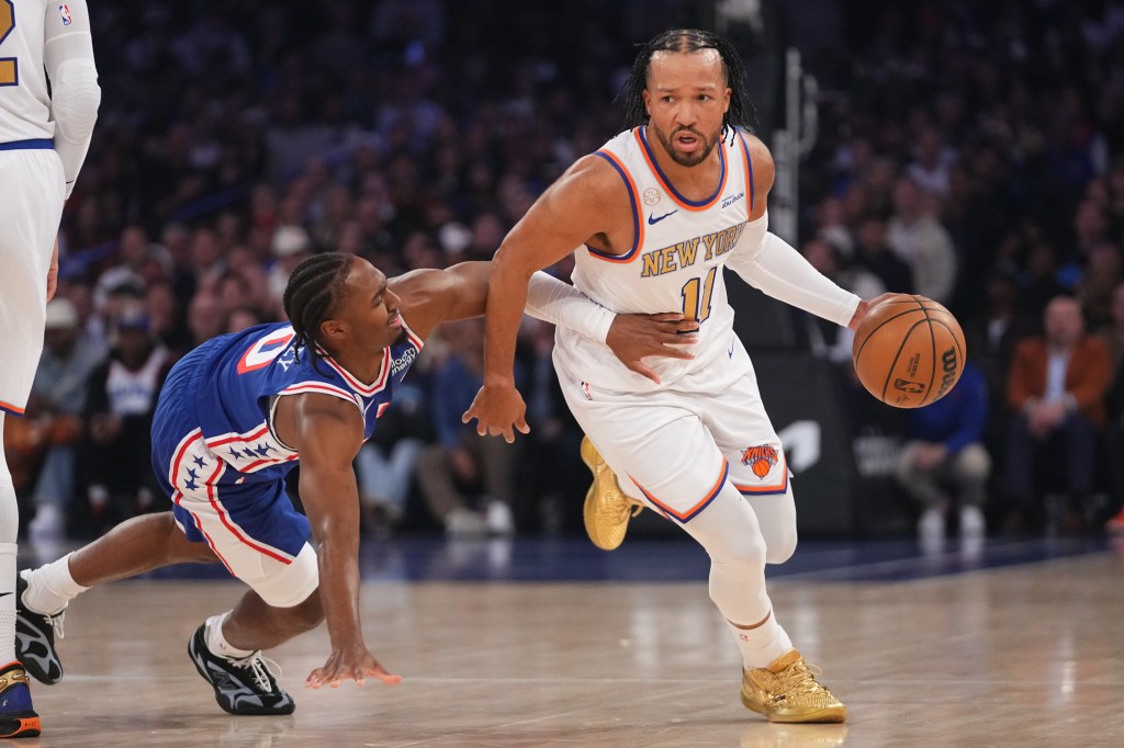 New York Knicks guard Jalen Brunson (11) drives past Philadelphia 76ers guard Tyrese Maxey during an NBA game.