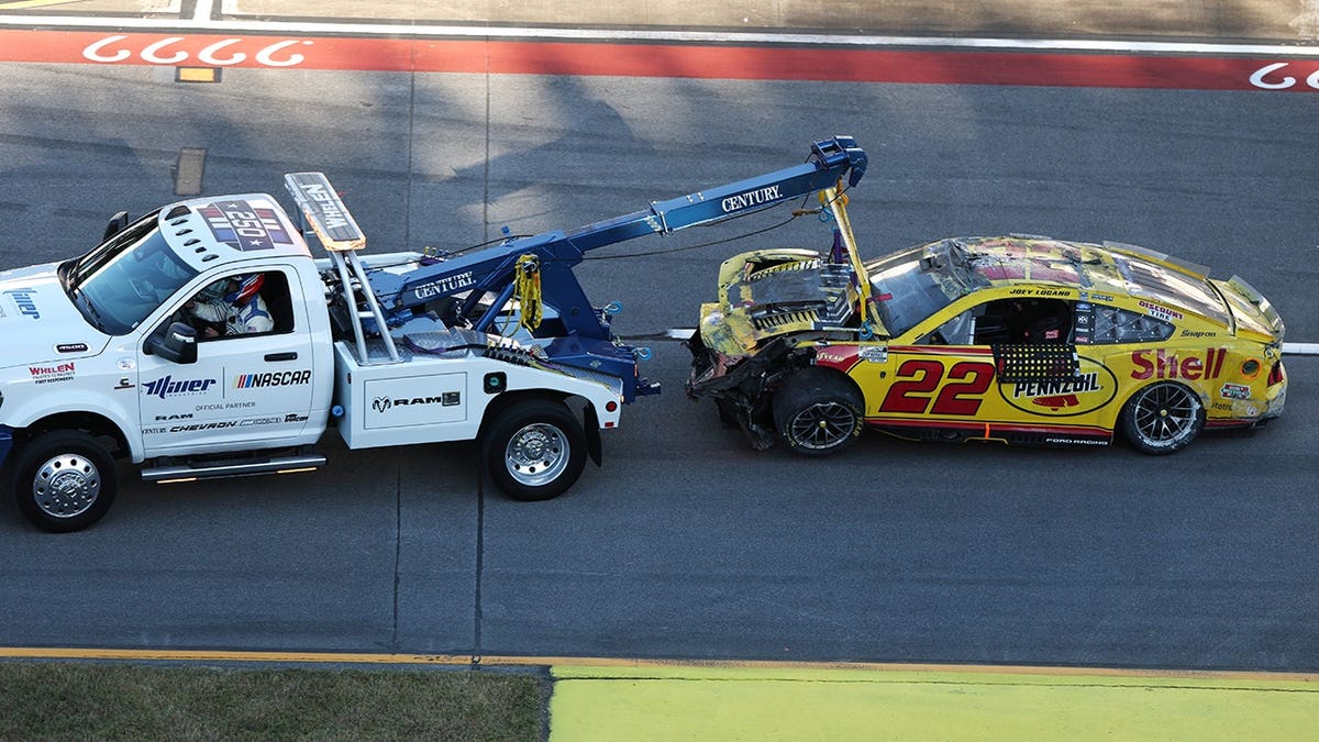 Joey Logano's No. 22 Shell Pennzoil Ford is towed after an on-track incident.